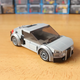 Image for article titled This Cool Fan-Made LEGO Iron Man Garage Has Some Great Models Of The Audi R8 And AC Cobra, Too